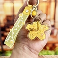 Yellow flower liquid keychain with drifting beads and a Happy Moments silicone wrist strap - Yellow