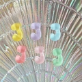 Mini transparent J-shaped resin charms in pastel yellow, purple, blue, and pink colors - Letter J