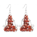 Detailed macro view of handmade wire-wrapped red stone earrings with bohemian yoga-style design - Red Jasper