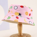 Detail of pink kids' sun hat featuring colorful tropical fruit patterns and fresh text - 54cm (3-8 Years) / Pink