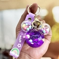 Purple Mickey-shaped quicksand keychain with macaron beads and a silicone wrist strap - Purple