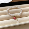 Elegant pearl bracelet with golden beads and a pink strawberry pendant with lobster clasp - Girly Pearl Pink Dragon Fruit Pendant Style