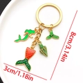 Gold ocean mermaid keychain with enamel shell and fishtail pendants showing 8cm length - Green Mermaid Keychain-LS556