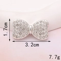 Macro shot of rhinestone bow charm with exact size 3.2cm x 1.7cm and weight 7.7g - D282 Silver Painted Bowknot (Large)