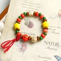 Handmade ceramic bracelet with red apple, green beads, and star charms in vintage style - Red Apple Tassel Style (1616-03) / Red