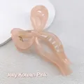 Detail view of large 13cm jelly pink bow hair claw clip with glossy resin texture - Jelly Korean Pink