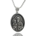 Macro view of oval Saint Joseph relief pendant in polished stainless steel finish - St. Joseph and Child