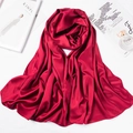 Macro detail of red satin silk scarf draped elegantly next to a perfume bottle - 180*70cm / Burgundy