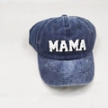 Detailed macro view of white MAMA letter embroidery on washed dark blue denim baseball cap - Adult MAMA / Navy Blue