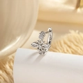 Single silver cross earring with sparkling zircon stones on white pedestal display - Hollow Cross Design Style (A903-3#)