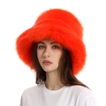 Detailed texture of thick orange faux fur on a women's plush winter bucket hat - Orange