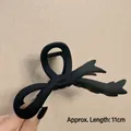 Matte black bow-shaped hair claw clip 11cm length shown on a neutral background - Matte Fishtail Black-11cm
