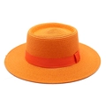 Close-up of bright orange boater straw hat featuring a detailed woven texture and ribbon - Orange