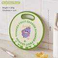 Beige round grape cartoon plastic cutting board for kids with green handle, 30cm diameter - Round Grape