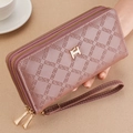 Detail view of pink long wallet with geometric embossed leather and dual gold zippers - Rouge Red