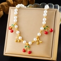 Beaded necklace with white imitation pearls and red cherry pendants on a golden cushion - Cherry Pendant Style (N3345)