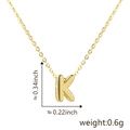 Detail view of gold letter K pendant showing dimensions 0.34 inch height and 0.22 inch width - Letter K