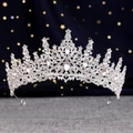 Close-up of a silver bridal crown featuring shimmering crystals on a dark starry background - Silver White Crystal