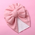 Close-up of a pink soft baby turban hat featuring a large elegant double-layered bow - One Size / Light Pink