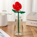 Red building block rose bouquet in clear glass vase on wooden tabletop decor - Rose 260-23 / Bag Packaging