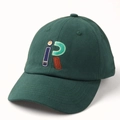 Close-up of dark green cotton baseball cap featuring retro letter R embroidery detail - Adjustable / Green