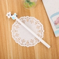 Cute white cartoon giraffe gel pen on a wooden desk with elegant lace paper - White Deer