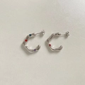 Macro detail of silver-colored wavy C-shape earrings with colorful inset gemstones - Silver Multicolor Zirconia (PEK1653)