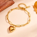 Detailed shot of golden stainless steel paperclip bracelet with heart pendant - Small Heart Gold Bracelet (O107)
