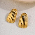 Detail of gold-plated titanium steel earrings featuring a textured fan wing shape - Exaggerated Shell