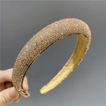 Detail showing hand-held thick champagne gold headband with full rhinestone inlay - Bright Champagne