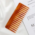 Elegant amber acetate wide-tooth comb for hair on white silk background - 15.1*6.1cm / Coffee