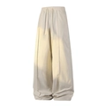 Wide-leg beige drawstring trousers featuring a vertical seam design and premium draped fit - Off White