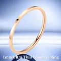 Close-up of a 1mm ultra-thin rose gold stainless steel ring with polished finish - US 10 / 1mm / Rose Gold