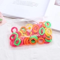 Macro shot of colorful high-elasticity knit hair ties in a daisy zip-lock pouch - 50Pcs/Bag / Fluorescent