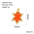 Macro view of a handmade orange and gold glass bead star pendant with dimensions and weight - Orange (Star)