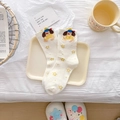 Creamy white mid-calf cotton socks featuring cute cartoon dog and yellow star patterns - Puppy in Yellow Shirt
