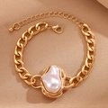 Detail of a chunky gold Cuban chain bracelet featuring a unique Baroque pearl and lobster clasp - Gold Baroque Pearl Chunky Chain Bracelet (S188)