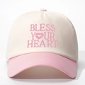 Détail de la broderie BLESS YOUR HEART sur une casquette de baseball bicolore - Blanc Cassé et Rose
