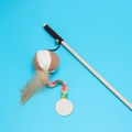 Interactive wooden cat wand toy with natural feathers, small bells and colorful fabric charms - Pumpkin Bell