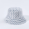 Detailed close-up of soft blue and white checkered plush fabric on a fuzzy bucket hat - M (56-58cm) / Blue
