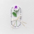 Detail of hand-knitted purple and white rose with Love Is Eternal ribbon and decorative card - Rose - Gradient Purple