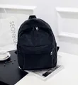 Minimalist black corduroy backpack for women featuring durable metal zipper pulls - Black / Plain Style