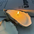 Natural oyster shell scented candle with flickering flame and white wax in a warm setting - Oyster Shell Candle [Approx. 9cm] / Freesia [Bagged]