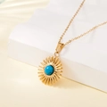 Gold stainless steel sunburst pendant necklace featuring a blue turquoise center stone - Blue Stone Sun Style (137515)