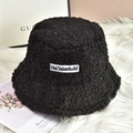 Women's warm black faux shearling bucket hat with stylish embroidered patch for winter - One Size / Black