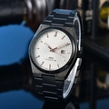 Detailed macro shot of white waffle dial with rose gold markers and PRX logo - 5-Black Case White Dial