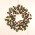 Christmas wreath featuring white-edged leaves, red berries, and natural pinecones - Iron Ring White Edge Leaf Red Berry Wreath