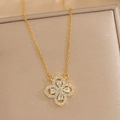 Macro detail of a golden flower pendant necklace with shimmering micro-paved zircons - Gold Necklace (557)