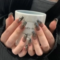 Macro detail of gradient coffee-colored nails with silver rhinestones and glitter accents - Z676 Dark Glory / Nail Glue Version