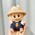 Plush doll outfit featuring a beige hat and blue denim overalls for Labubu figures - Carrot-shaped Overalls + Bunny Brown Hat / First And Second Generation Keychains Are Compatible With La Cloth Dolls. Dolls Not Included.